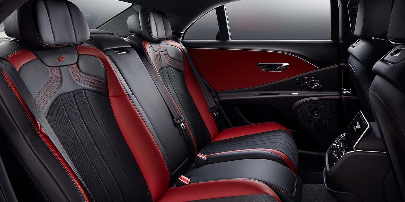 Bentley Bucuresti Bentley Flying Spur S sedan rear interior in Beluga black and Hotspur red hide with S stitching