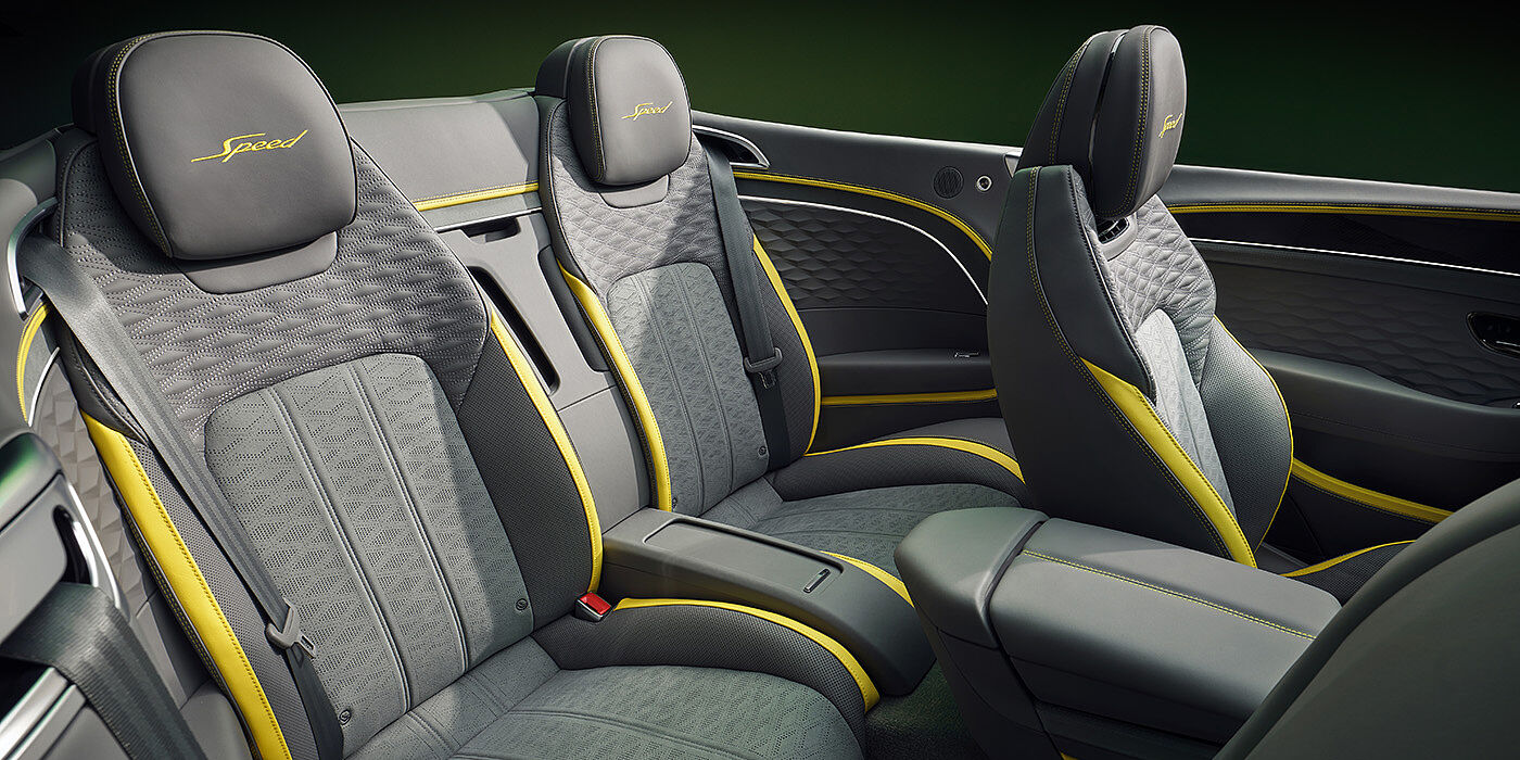 Bentley Bucuresti Bentley New Continental GTC Speed convertible rear interior with unique Speed colour split in Gravity Grey and Cyber Yellow hide colours, and contrast stitched headrest emblems 