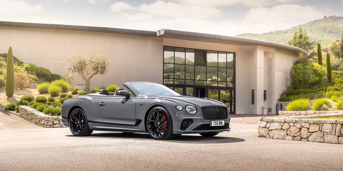 Bentley Bucuresti Bentley Continental GTC S convertible in Cambrian Grey paint front 34 static near house
