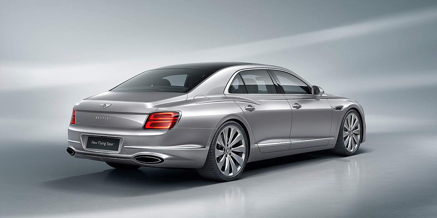 Bentley Bucuresti New Bentley Flying Spur sedan rear view in Silverlake paint with ten spoke wheels and chrome matrix grille