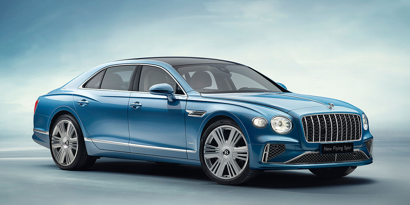 Bentley Bucuresti New Bentley Flying Spur Azure sedan front view in Light windsor blue by Mulliner paint with 22 inch Azure wheels and chrome exterior details