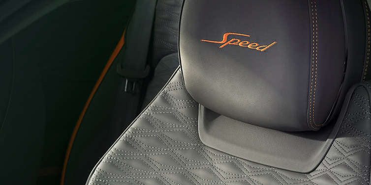 Bentley Bucuresti Bentley Continental GT Speed coupe seat detail in Gravity Grey hide and Speed emblem in Mandarin by Mulliner coloured embroidery