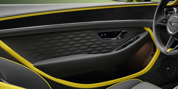 Bentley Bucuresti Bentley Continental GTC Speed convertible interior door details featuring Gravity Grey and Cyber Yellow by Mulliner hides and high gloss carbon fibre veneer